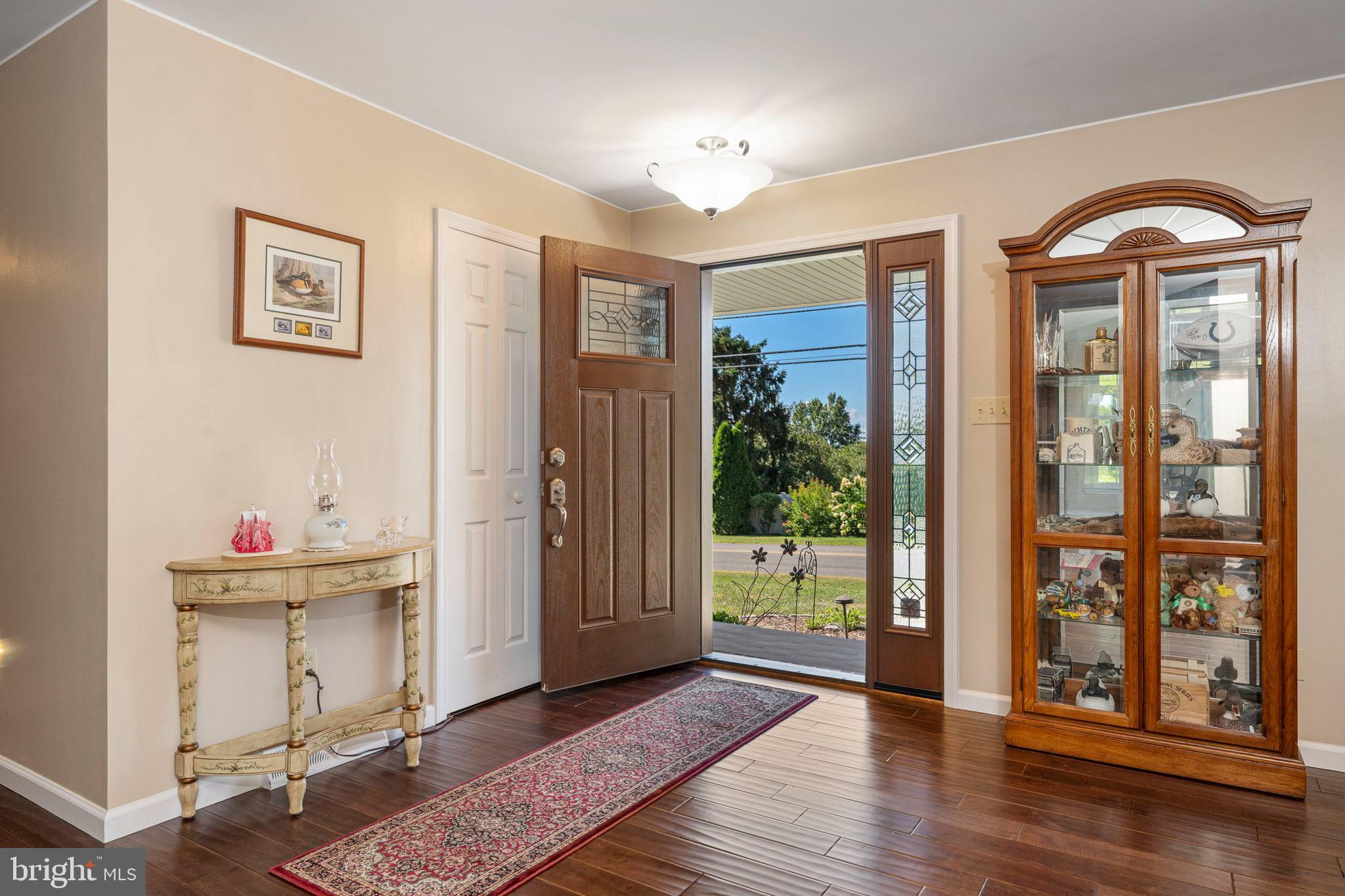 335 Rudy Dam Road Lititz, PA 17543 - Photo 4 of 32 a view of a room with wooden floor and windows