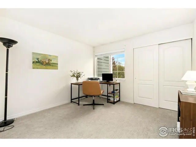 a living room with furniture a window and a table