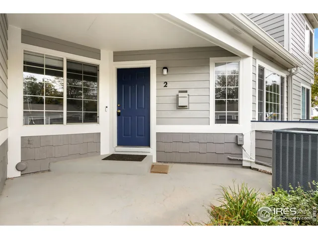 a front view of a house with a large window