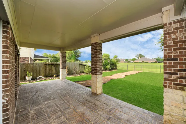 a view of a patio with a backyard