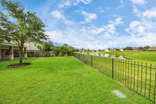 a view of a garden with a lake view