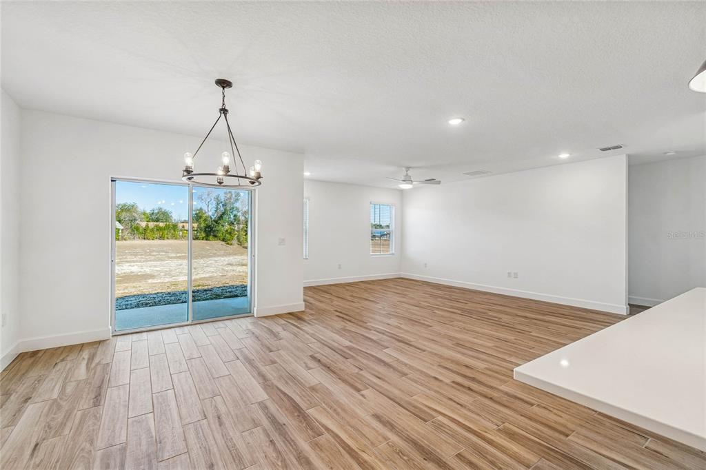 3617 Southwest 153rd Pl Road, Unit 6 Ocala, FL 34473 - Photo 14 of 31 a view of empty room with wooden floor and stove