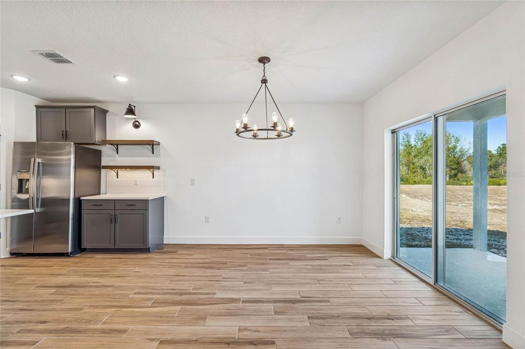 3617 Southwest 153rd Pl Road, Unit 6 Ocala, FL 34473 - Photo 16 of 31 a kitchen with stainless steel appliances granite countertop a refrigerator and a sink