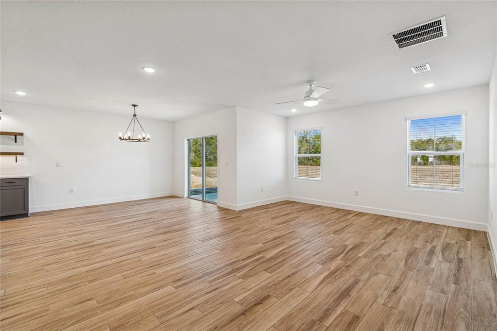 3617 Southwest 153rd Pl Road, Unit 6 Ocala, FL 34473 - Photo 21 of 31 wooden floor in an empty room with a window