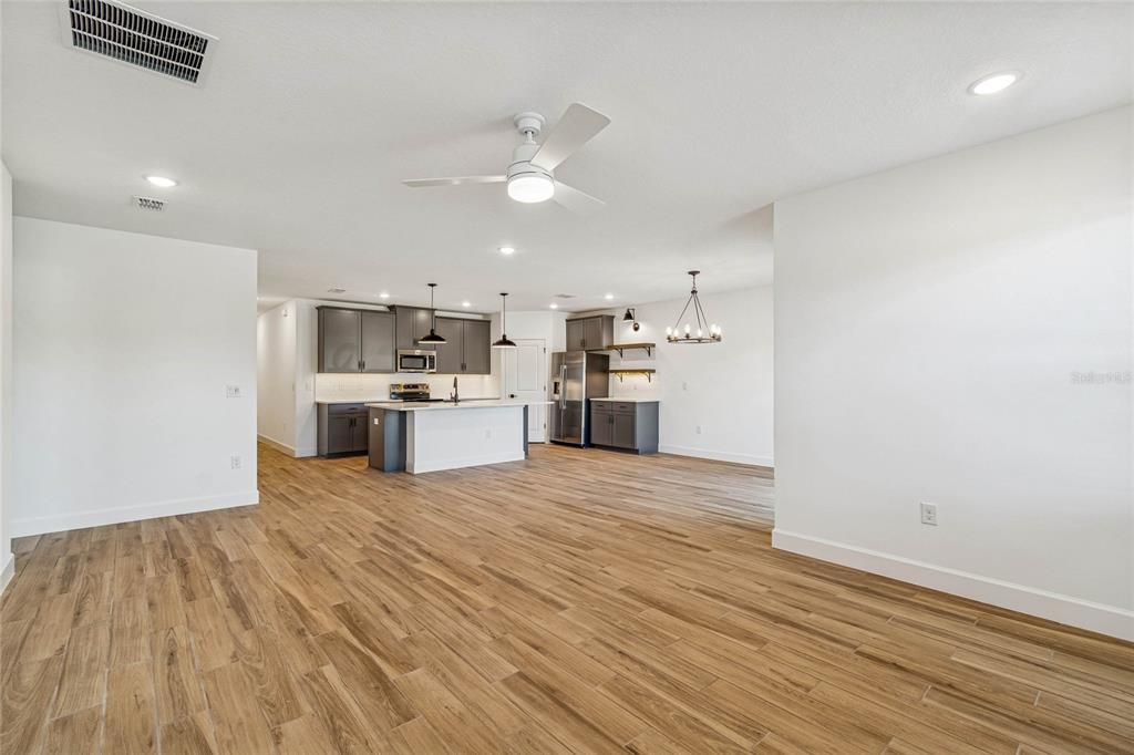 3617 Southwest 153rd Pl Road, Unit 6 Ocala, FL 34473 - Photo 22 of 31 a view of a kitchen with a dishwasher cabinets and wooden floor