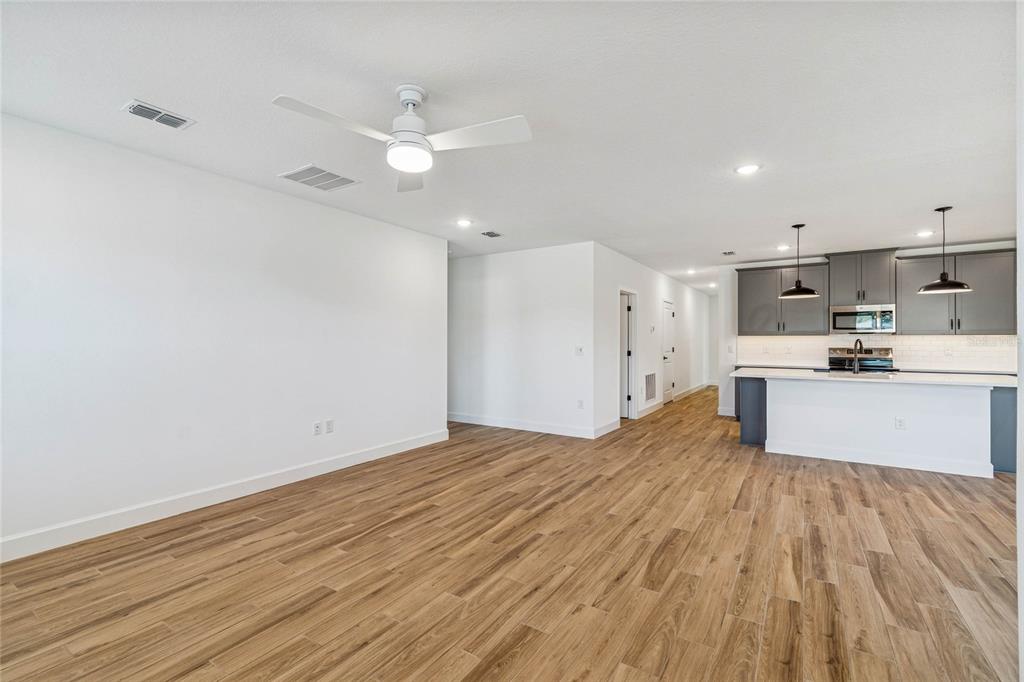 3617 Southwest 153rd Pl Road, Unit 6 Ocala, FL 34473 - Photo 23 of 31 a view of kitchen with granite countertop cabinets and wooden floor