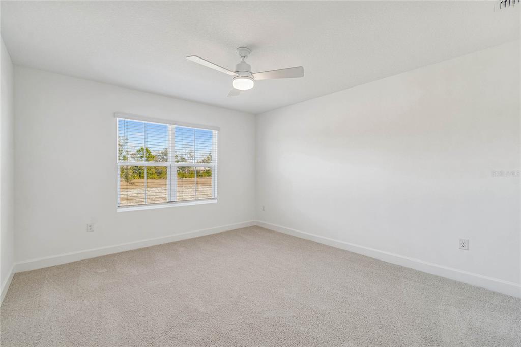 3617 Southwest 153rd Pl Road, Unit 6 Ocala, FL 34473 - Photo 24 of 31 an empty room with a window and ceiling fan