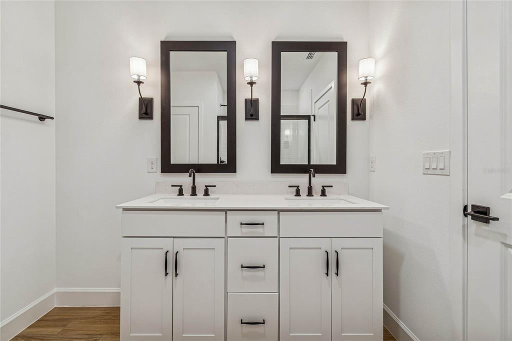 3617 Southwest 153rd Pl Road, Unit 6 Ocala, FL 34473 - Photo 28 of 31 a bathroom with double vanity sinks and a mirror
