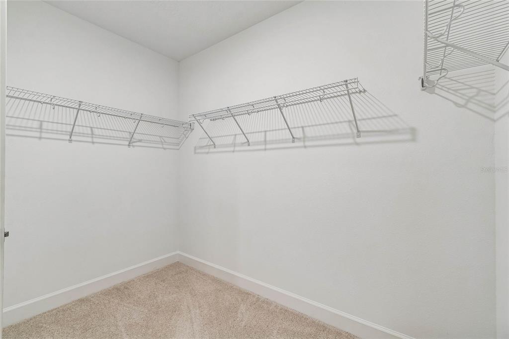 3617 Southwest 153rd Pl Road, Unit 6 Ocala, FL 34473 - Photo 29 of 31 a view of a room with racks on the wall