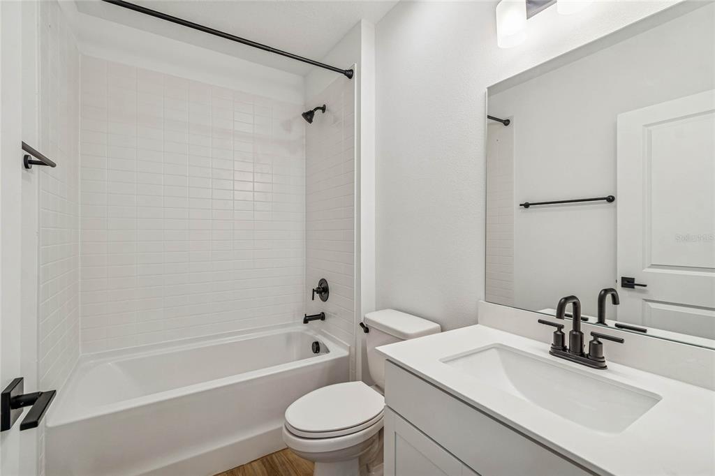 3617 Southwest 153rd Pl Road, Unit 6 Ocala, FL 34473 - Photo 5 of 31 a bathroom with a sink toilet and shower