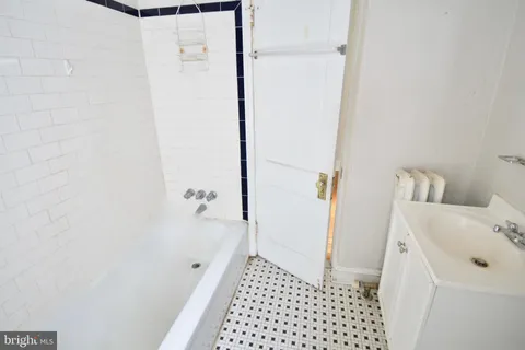 a bathroom with a sink and a shower