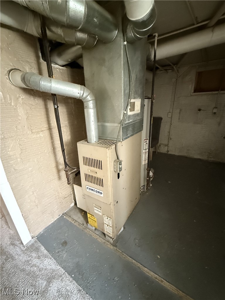 877 Garfield Street Akron, OH 44310 - Photo 13 of 16 Utility room with water heater