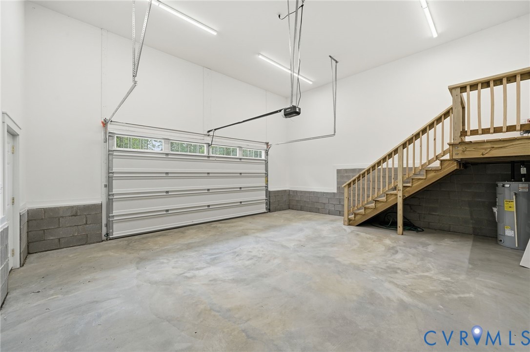 239 Bumpass Road Bumpass, VA 23024 - Photo 23 of 44 Spacious garage featuring a concrete floor, overhe