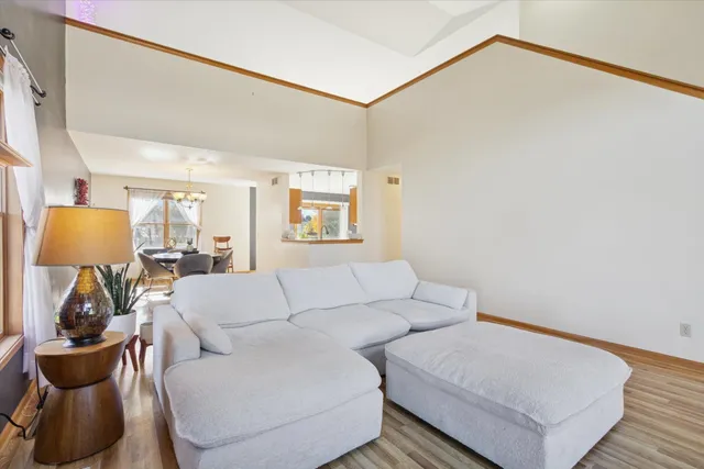 a living room with furniture and a lamp