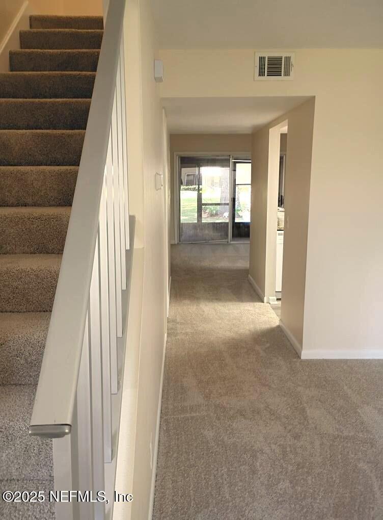 1265 The Grove Road Orange Park, FL 32073 - Photo 3 of 13 a view of a hallway with wooden floor and entryway