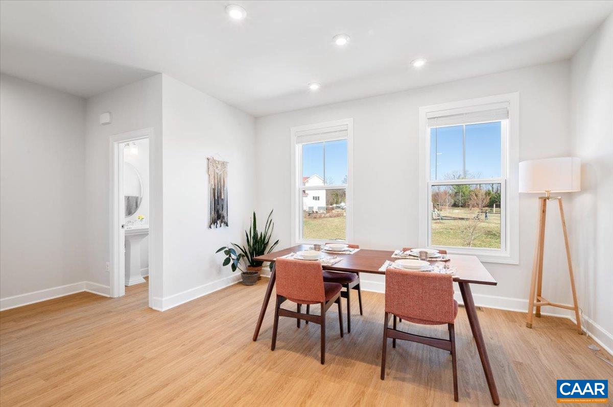 5963 McComb Street Crozet, VA 22932 - Photo 27 of 65 a view of a dining room with furniture and wooden floor