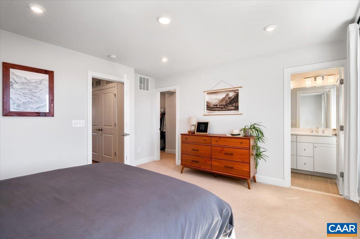 5963 McComb Street Crozet, VA 22932 - Photo 37 of 65 a bedroom with a bed and a view of living room