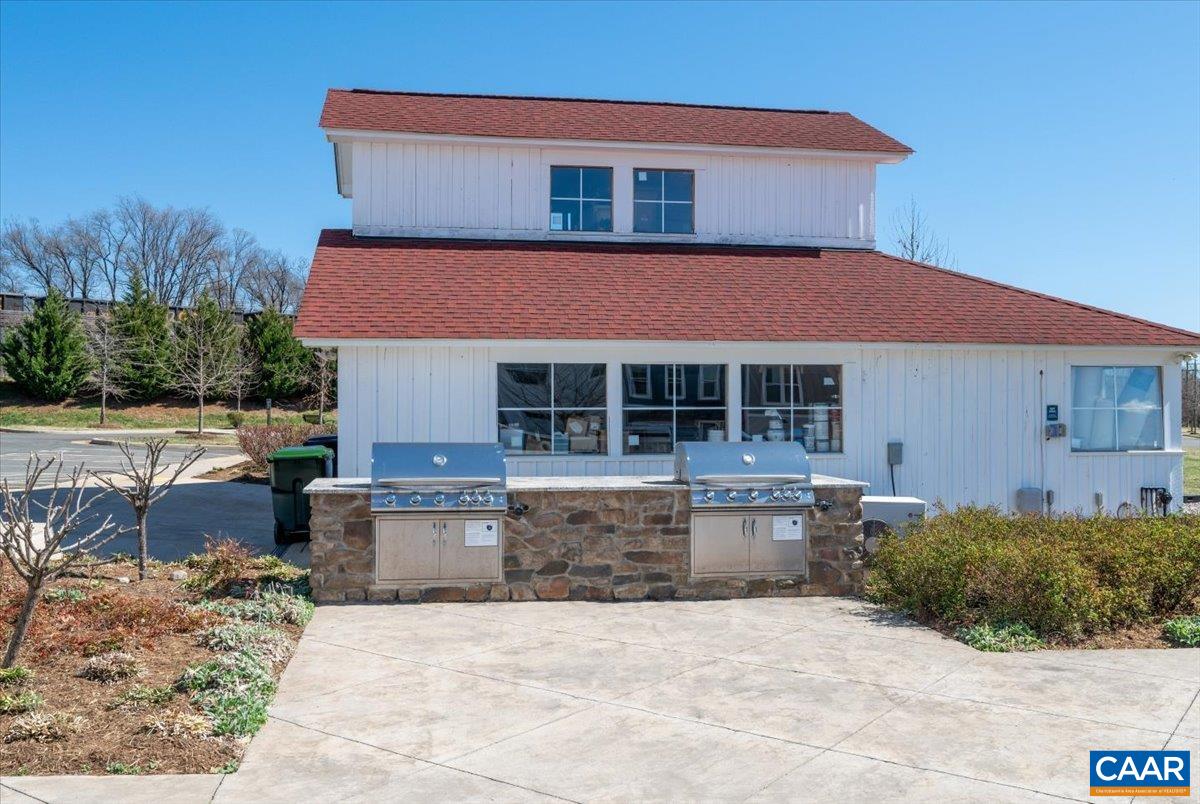 5963 McComb Street Crozet, VA 22932 - Photo 48 of 65 a front view of a house with a yard
