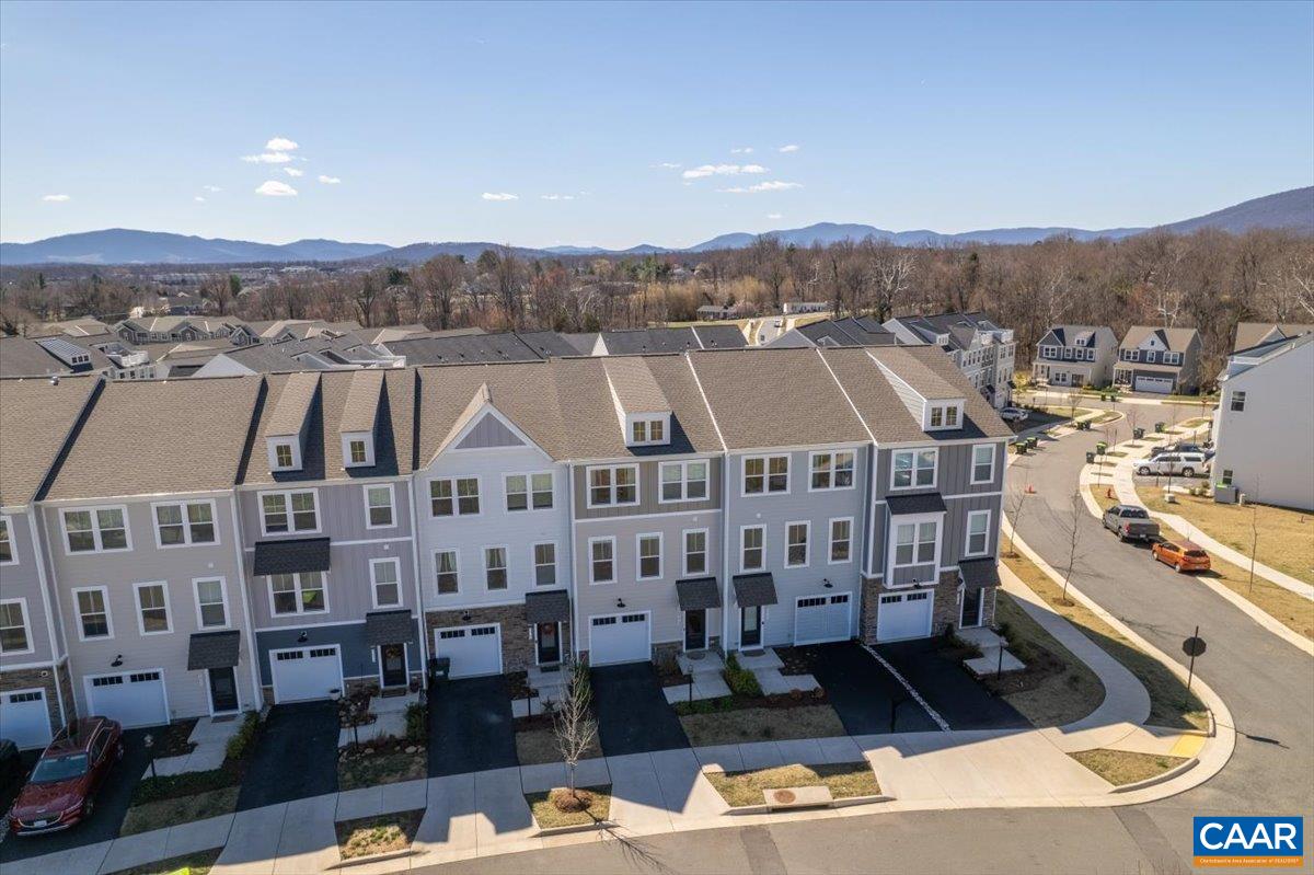5963 McComb Street Crozet, VA 22932 - Photo 58 of 65 a aerial view of a large building and couple of cars parked in front of it
