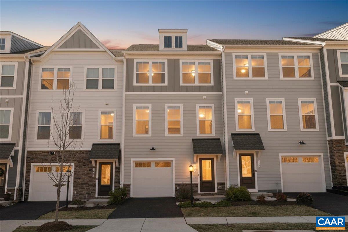 5963 McComb Street Crozet, VA 22932 - Photo 61 of 65 a front view of a residential apartment building with a yard