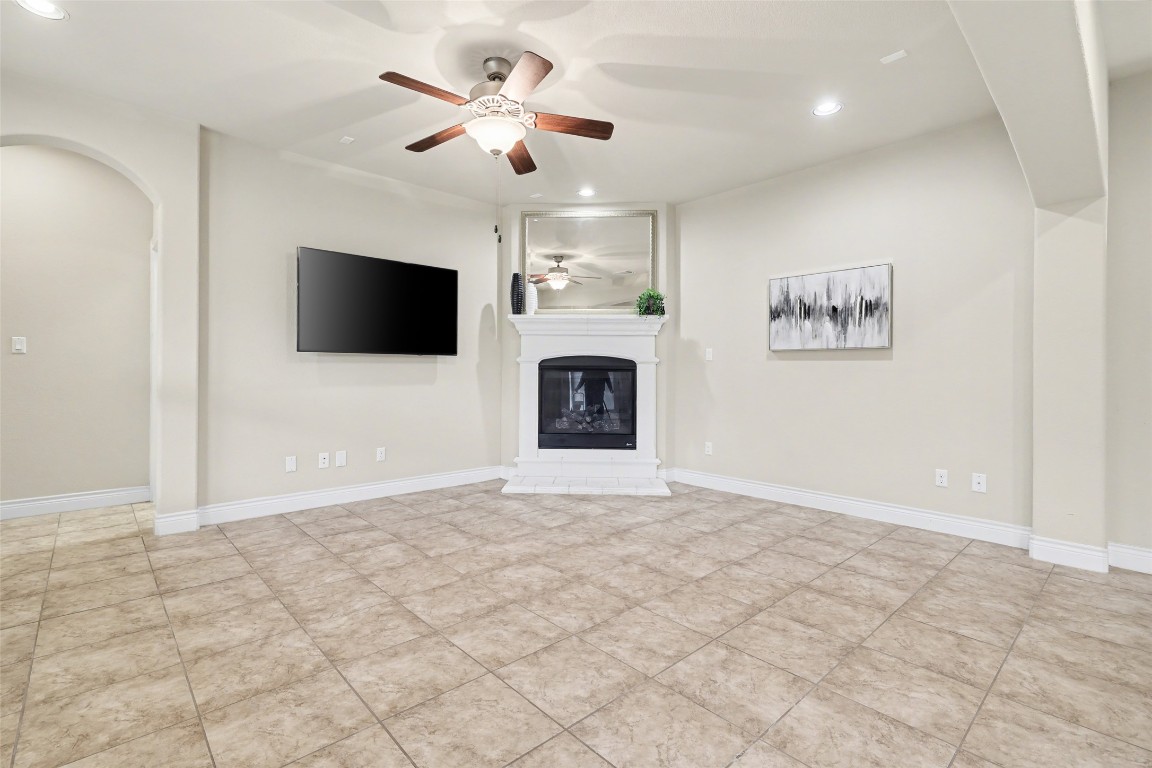 116 Trailing Lantana Drive, Unit G Georgetown, TX 78628 - Photo 14 of 38 a view of a livingroom with a flat screen tv wooden floor and a chandelier fan