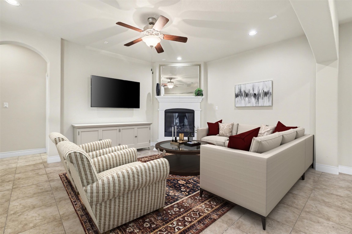 116 Trailing Lantana Drive, Unit G Georgetown, TX 78628 - Photo 15 of 38 a living room with fireplace furniture and a flat screen tv
