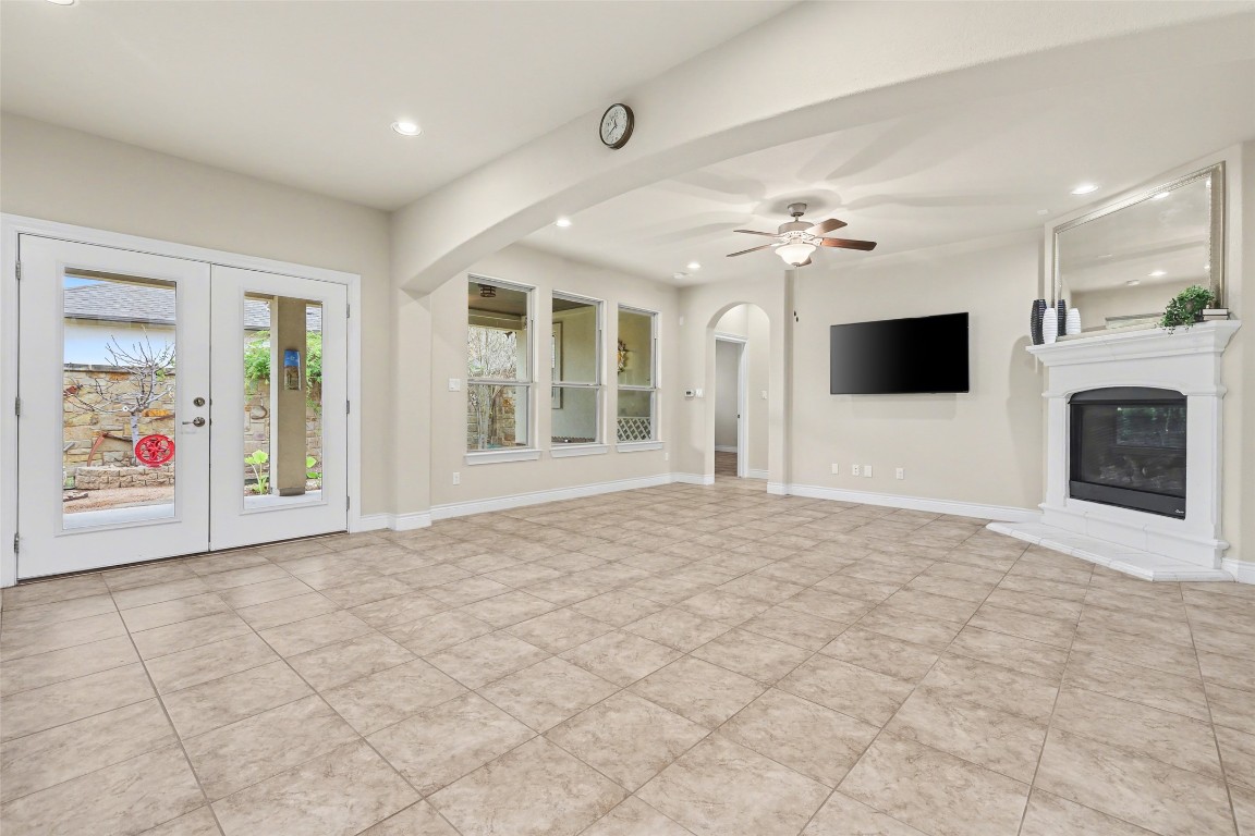 116 Trailing Lantana Drive, Unit G Georgetown, TX 78628 - Photo 18 of 38 a view of an empty room with a fireplace and a window