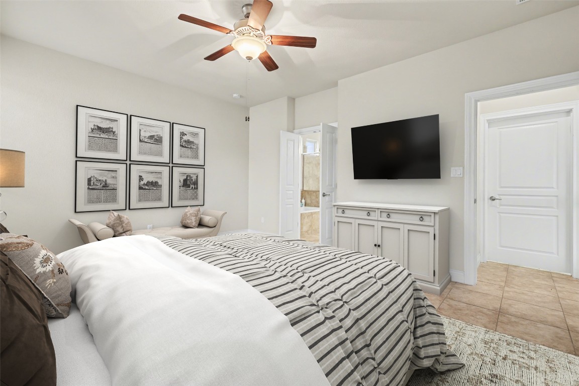 116 Trailing Lantana Drive, Unit G Georgetown, TX 78628 - Photo 24 of 38 a bedroom with a bed a flat screen tv and a window