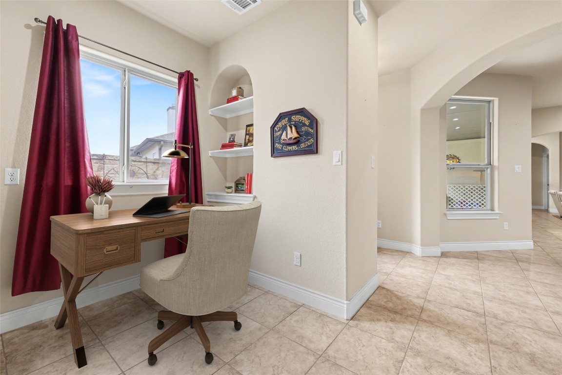116 Trailing Lantana Drive, Unit G Georgetown, TX 78628 - Photo 7 of 38 a view of a workspace with furniture and a window
