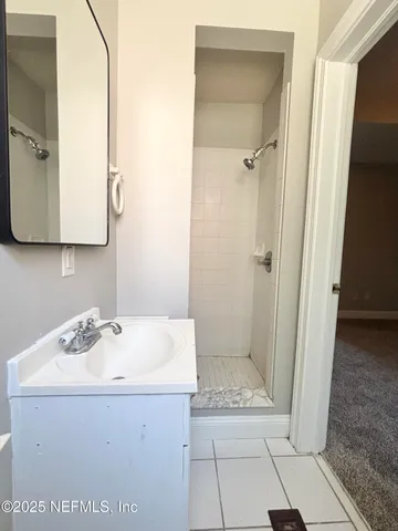 a bathroom with a sink and a mirror