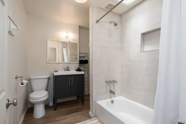 a bathroom with a bathtub toilet and sink