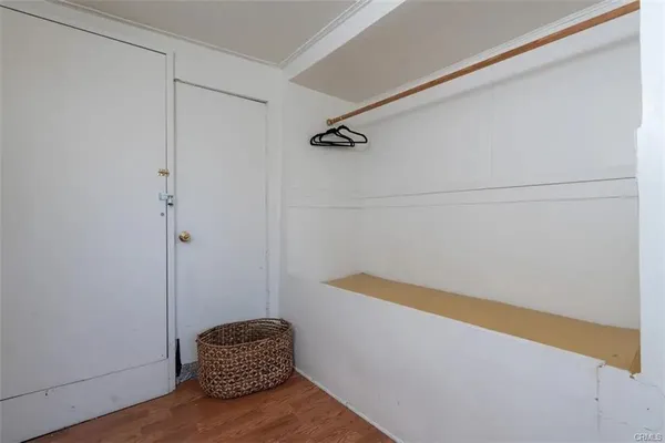 a view of small space with racks on the wall