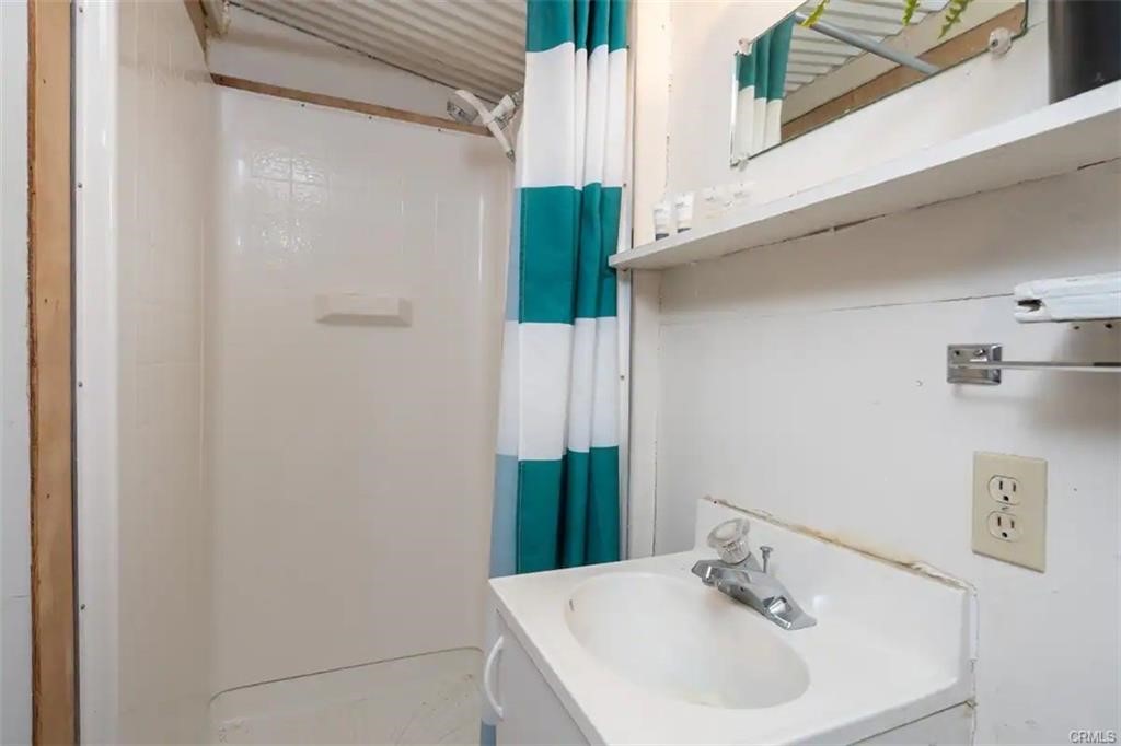 38797 Highway 41 Oakhurst, CA 93644 - Photo 18 of 27 a bathroom with a sink and a mirror