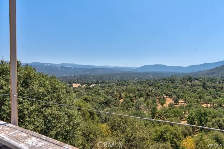 38797 Highway 41 Oakhurst, CA 93644 - Photo 2 of 27 a view of a green field