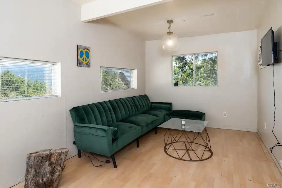 38797 Highway 41 Oakhurst, CA 93644 - Photo 24 of 27 a living room with furniture and a wall painting