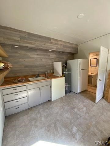 38797 Highway 41 Oakhurst, CA 93644 - Photo 8 of 27 a view of a kitchen with refrigerator and microwave