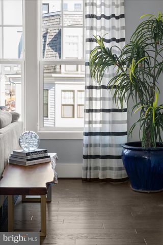 a view of a room with a table and chairs
