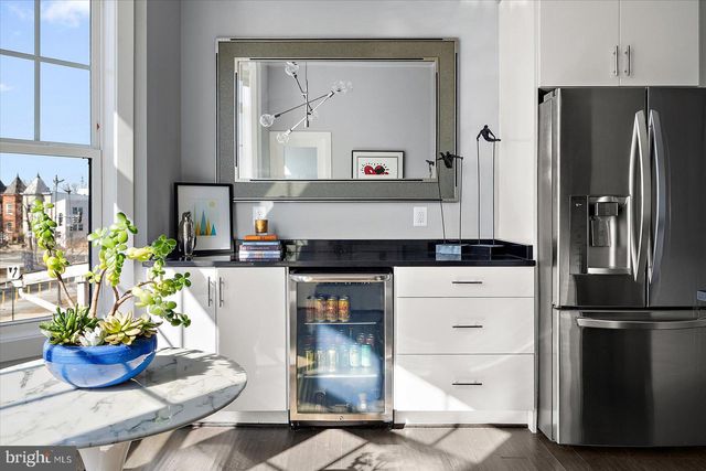 a room with a cabinet and a window