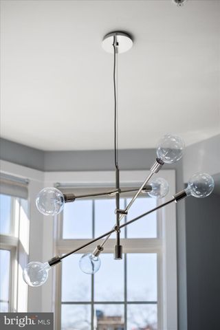 a bedroom with a bed and a television