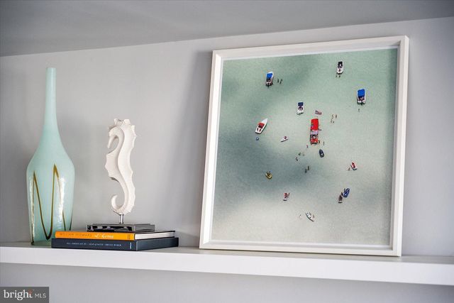 a view of a livingroom with furniture and a flat screen tv