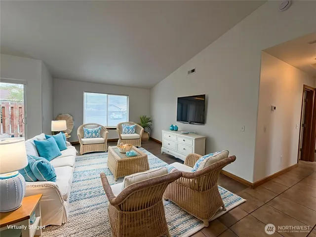 a view of an empty room with glass door