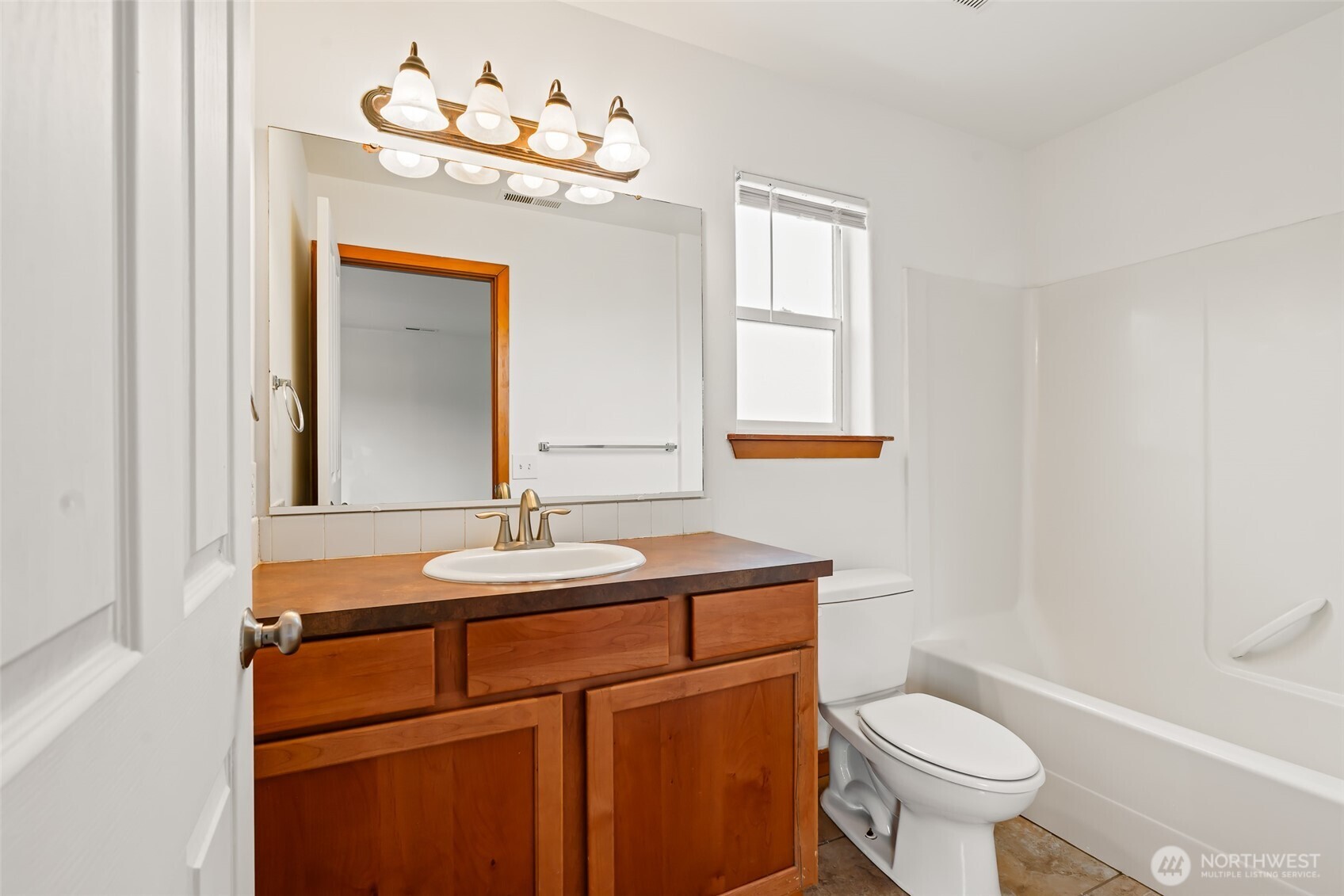 509B Clubhouse Way, Unit A Mattawa, WA 99349 - Photo 20 of 29 a bathroom with a sink vanity mirror and toilet