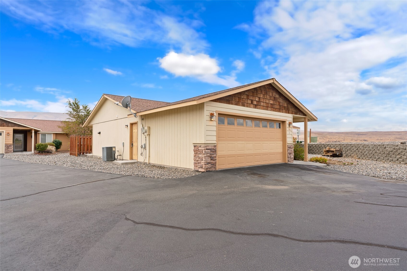 509B Clubhouse Way, Unit A Mattawa, WA 99349 - Photo 27 of 29 a view of a house with a patio