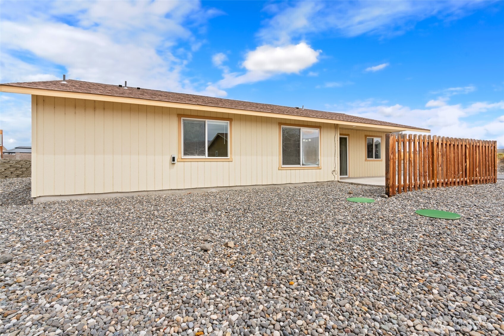 509B Clubhouse Way, Unit A Mattawa, WA 99349 - Photo 29 of 29 a view of a house with a backyard