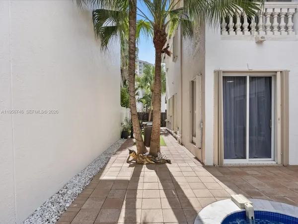 a front view of a house with outdoor seating
