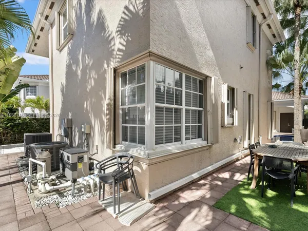 a large kitchen with a table and chairs