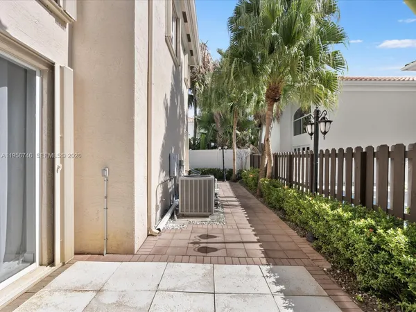 a kitchen with a sink a stove and cabinets