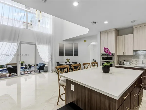 a view of a livingroom with furniture window and wooden floor