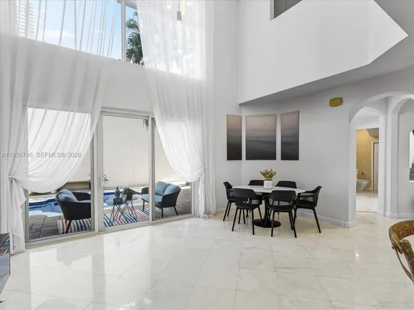 a bedroom with a large bed and a couch