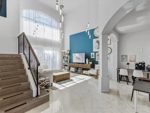 a bathroom with a granite countertop sink mirror and vanity